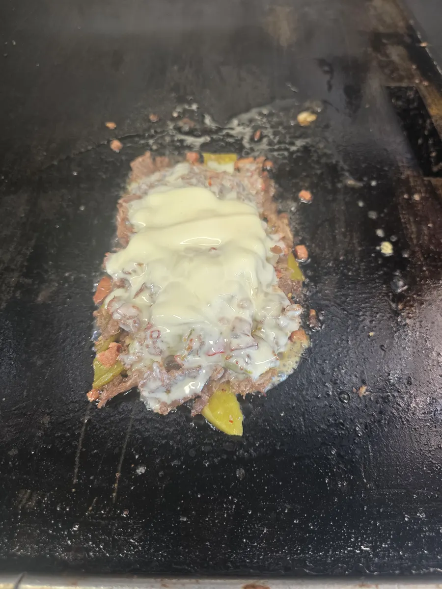 The cheese melting down into the chopped hotlink, sirloin and green chile