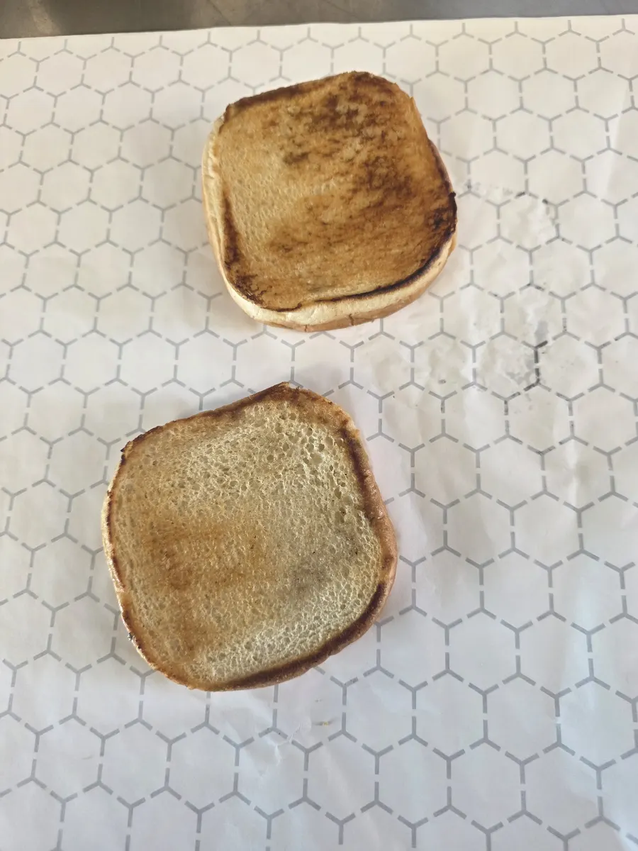 Two bun halves toasted golden brown