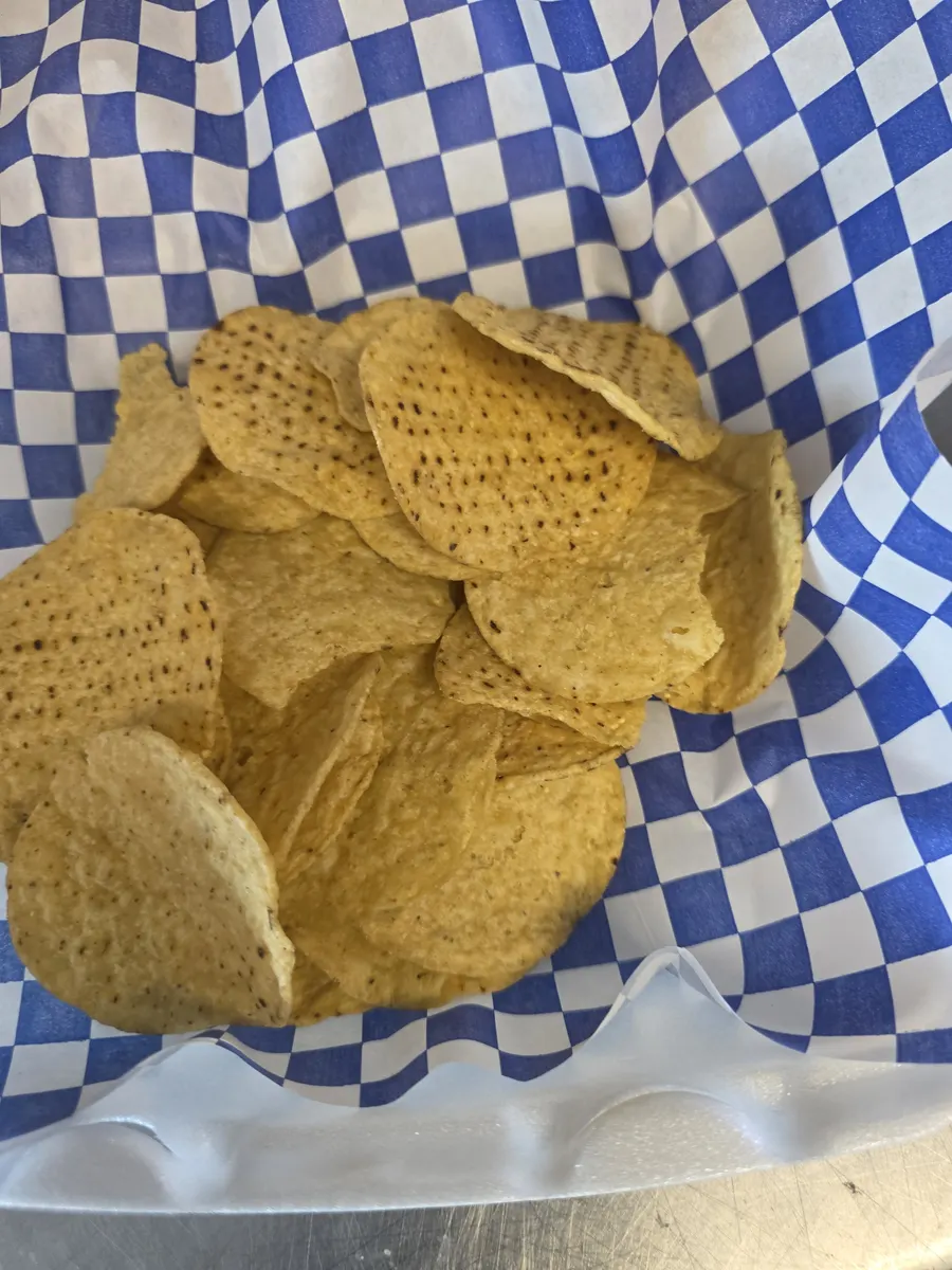 Corn chips in a blue checkered basket, ready to load